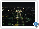 The view from the middle level of the Eiffel Tower by night.